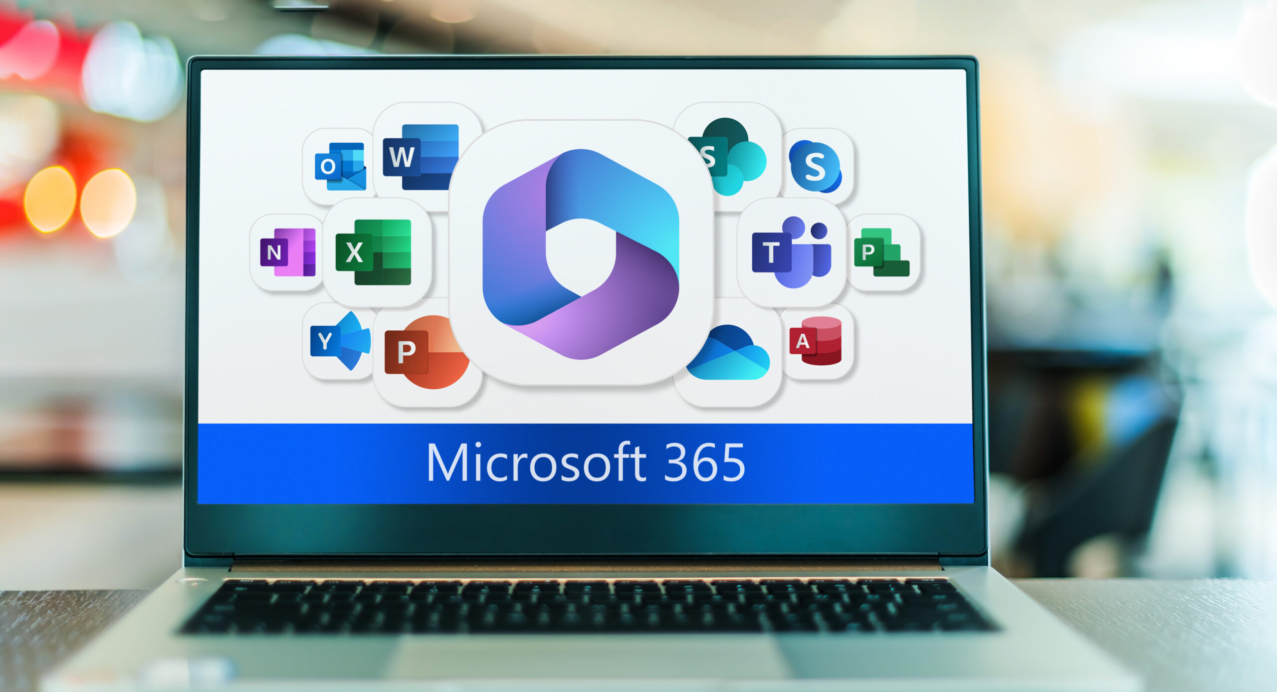 Laptop computer displaying logos of Microsoft 365